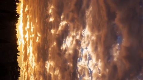 Timelapse of Heavenly Sunset Cloudscape over Hillside Landscape -Vertical/Pan- Vídeos de archivo 71544938