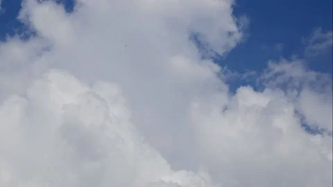 Timelapse - Heavy rain clouds recede and the blue sky appears Stock Footage 134168429