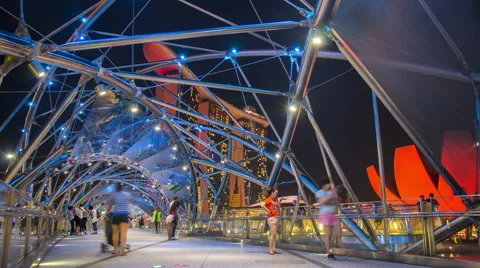 Timelapse of Helix Bridge and Marina Bay Sands Hotel and Lightshow Stock Footage 61865542