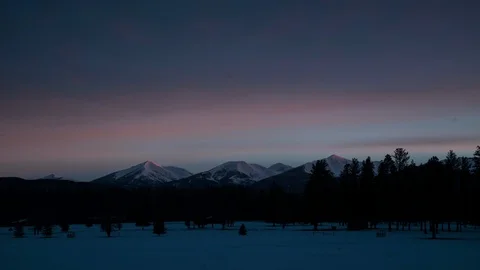 Timelapse of high altitude mountains with cloudy sky panorama during sunrise Stock Footage 121575962