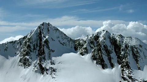 Timelapse of high altitude mountains with cloudy blue sky background Stock Footage 121577102
