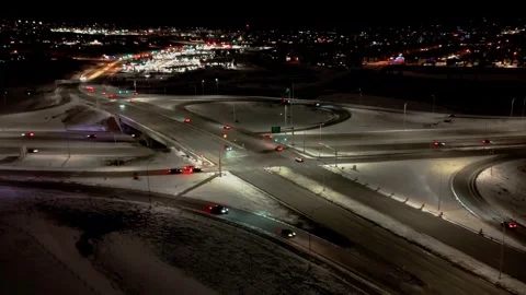Timelapse of a high-angle aerial view of a busy highway interchange and suburban Stock Footage 330848505