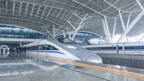 Timelapse，A high speed bullet train departs the modern Wuhan train station Stock Footage 74214519