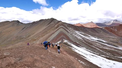 Timelapse of hikers walking up rainbow mountain, peru Stock Footage 100517076