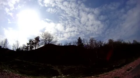 Timelapse of a hill with trees and moving clouds Stock Footage 48568618