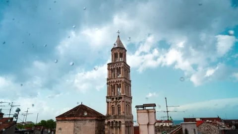 Timelapse of Historic Bell Tower and Moving Clouds over Old Town Rooftops 库存影片 331104850