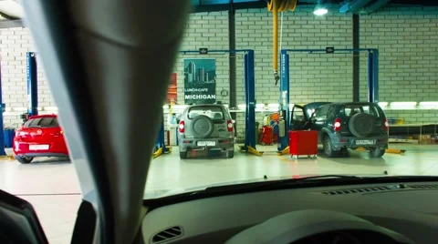 Timelapse Horizontal slide shot from the inside out in a service station garage Stock-Footage 58909125