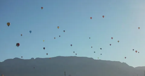 Timelapse of Hot Air Balloons Over Sandia Mountains During 2025 Albuquerque.. Stock Footage 335669059