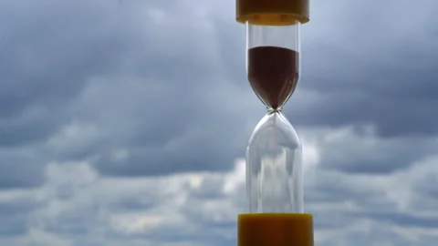 Timelapse Hourglass on Vlue Clouds Background Stock Footage 213494932