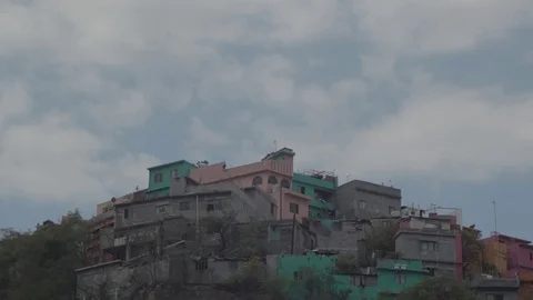 Timelapse of houses with clouds in the back Stock Footage 129841175