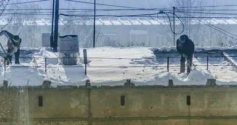 Timelapse of how workers remove snow from the roof of a residential building Stock-Footage 129547076