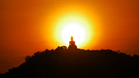 Timelapse hue sunset over and behind silhouette Phuket big buddha statue on h Video stock 127734083