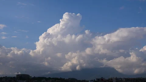 Timelapse of huge white clouds together forming different shapes and waves Stock Footage 258652349