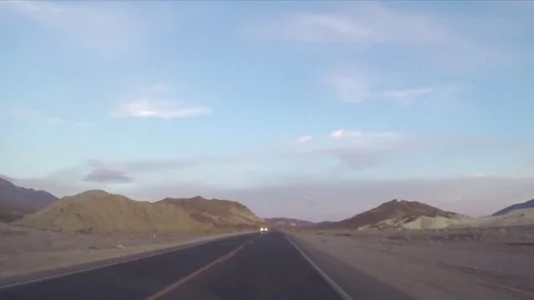 Timelapse hyperlapse of driving on asphalt road in Death valley, California,  Stock Footage 69980994