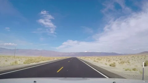 Timelapse hyperlapse of driving on a mountain, asphalt road in Death valley.. Stock Footage 70577994