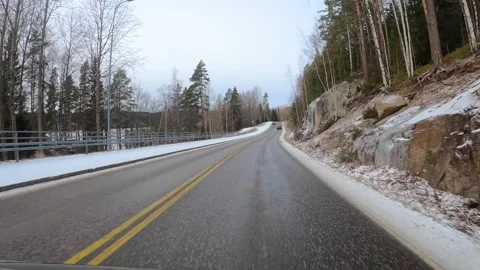 Timelapse hyperlapse FPV of car driving along snowy country roads in Finland Stock Footage 155065418