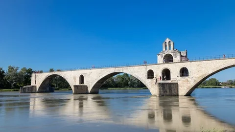 Timelapse hyperlapse of historic broken Pont d’Avignon bridge over Rhone river Stock Footage 100876644