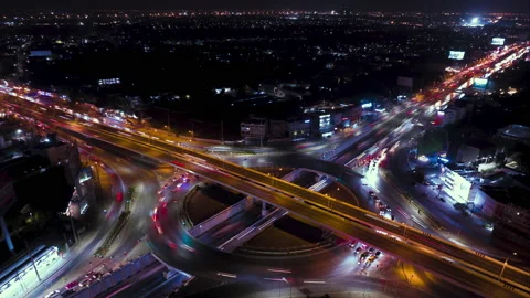 Timelapse hyperlapse rotate aerial of a traffic circle in bangkok at night. 4K P Stock Footage 231148463