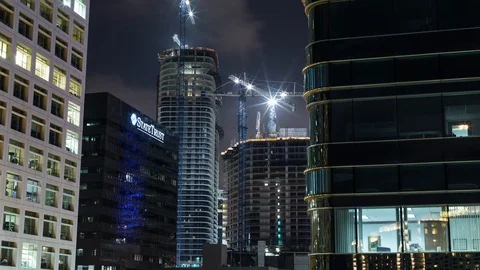 Timelapse hyperlapse of skyscraper buildings, construction Cranes on rooftop. Stock Footage 100839702