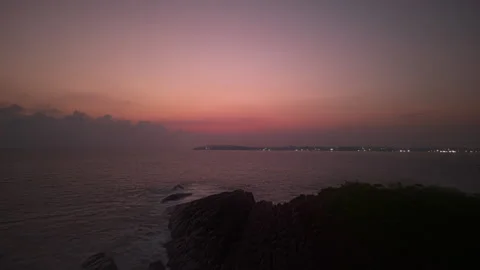 Timelapse, hyperlapse of sunset over ocean, colors changing in sky. Waves crash Stock Footage 265155660