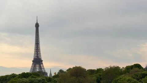 TIMELAPSE | Iconic Eiffel Tower standing over Paris skyline Stock Footage 337451111