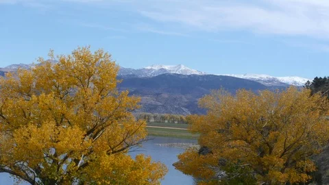 Timelapse of a icy mountains between autumn color trees, in Mono lake Stock Footage 72422306