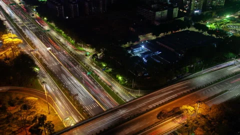 Timelapse illuminated overpass road over highway in Shenzhen zoom out Stock Footage 121895261