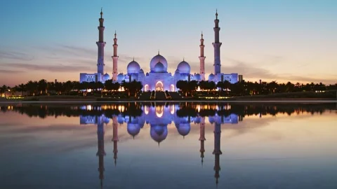 Timelapse illuminated stunning Sheikh Zayed Grand Mosque at sunset, Abu Dha.. Stock Footage 309806180