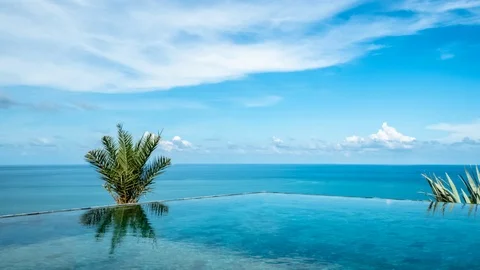 Timelapse of Infinity Edge Swimming Pool with Sea View in Tropical Country Stock Footage 111794671