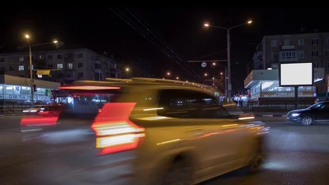 Timelapse of the intersection with busy traffic of the night city of Ukraine Stock Footage 125487421