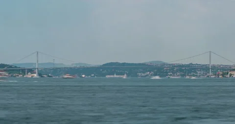 Timelapse of Istanbul Bosphorus Bridge at Sunset, traffic lights, city skyline Stock Footage 201804768