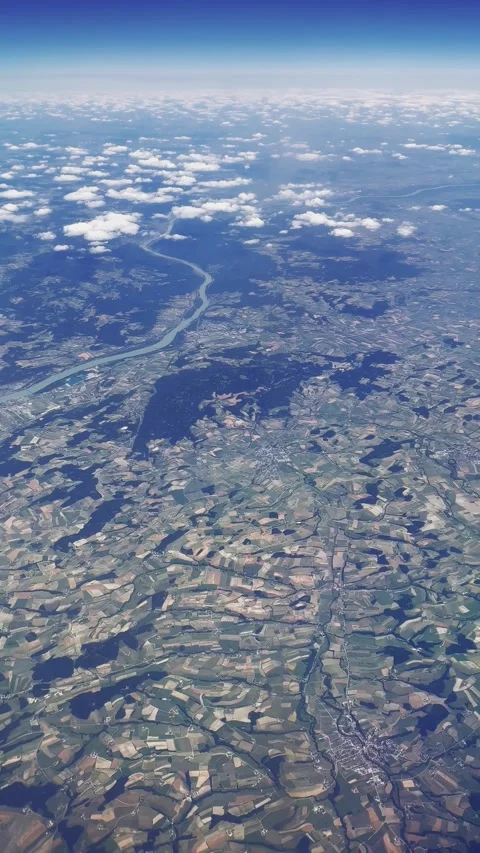Timelapse of jet plane flying on sky above river and agriculture field. Plane Stock Footage 299501018