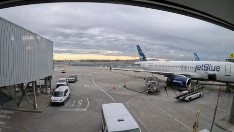 Timelapse of JetBlue flight fueling at gate at before departing Stock Footage 242813525