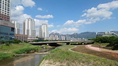 Timelapse of a landscape with a view of the stream and Mt. Bukhan Stock Footage 310702037