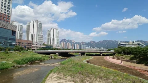 Timelapse of a landscape with a view of the stream and Mt. Bukhan Stock Footage 310702483
