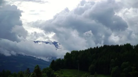 Timelapse landscape with white clouds and green forest - paraglider flies by Video stock 171182924