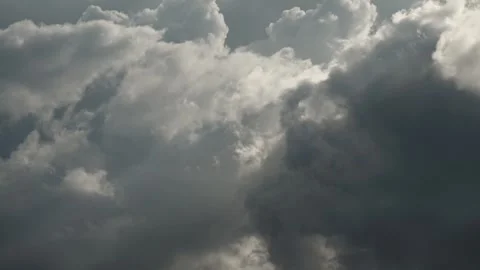 Timelapse of a large anvil shaped thunderstorm clouds building above a forest of Stock Footage 312945211