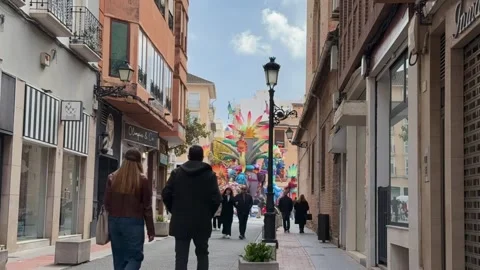TIMELAPSE | Large Fallas de Gandia ninot art installation with crowded street Stock Footage 333807189
