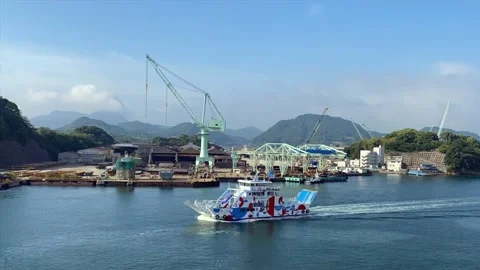 Timelapse, a large shipyard at work and with a passage of a colorful ship Stock Footage 196861900