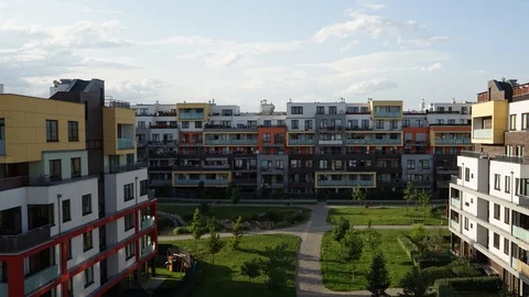 Timelapse of light clouds rolling over residential apartment complex Video stock 91398827