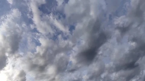 Timelapse light fluffy grey clouds moving low across sky. natural background. Stock Footage 302072187