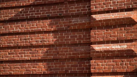 Timelapse Light Shadow Crawls Slowly on Old Red Brick Wall Stock Footage