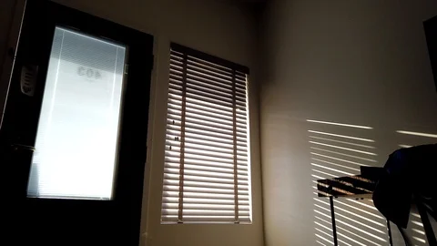 Timelapse light through blinds, shadows on the wall Stock Footage 124665064