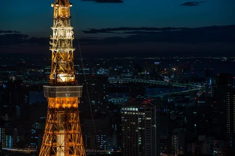 Timelapse of light up Tokyo Tower in middle of city in the morning, Tokyo Stock Footage 136138691