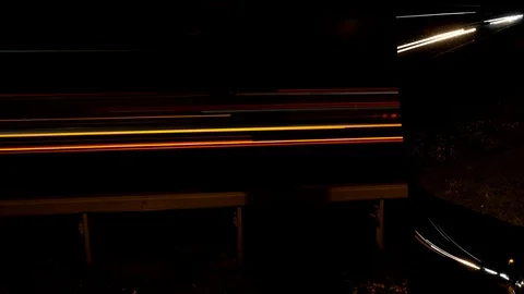 Timelapse of light trails from different directions through a truck mirror Stock Footage 120975931