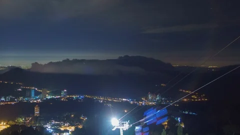 Timelapse light trails of moving cable cars overlooking scenic mountain view  Video stock 95994545