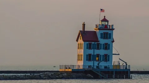 Timelapse of Lighthouse in Lorain Ohio on Lake Erie at Sunset Stock Footage 81314632