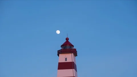 Timelapse of lighthouse with moon passing by Stock Footage 89946954
