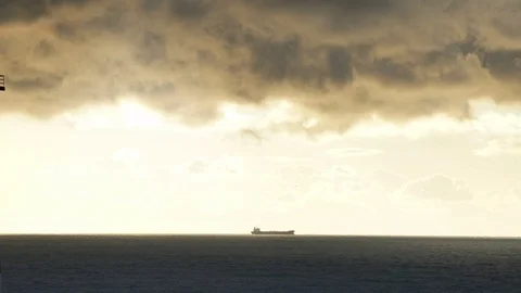 Timelapse lighthouse on the sea under stormy clouds and with the ship in the Stock-Footage 69790694