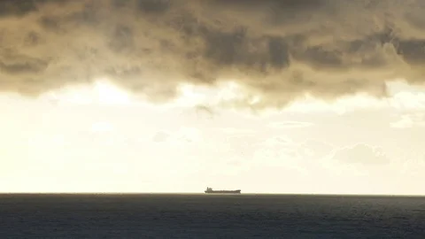 Timelapse lighthouse on the sea under stormy clouds and with the ship in the Видео 70658234